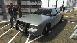 Two IAA agents near their Unmarked Cruiser.