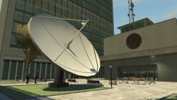 A satellite dish behind the conference building.