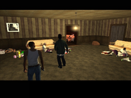 Carl Johnson and Ryder about to attack the Ballas in a building in Idlewood.