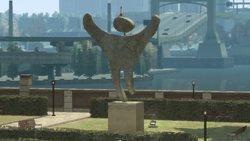 Unnamed Civilization Committee sculpture with a cone on its head.