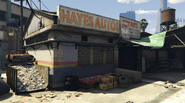 Front of Hayes Autos with closed door.