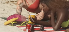 An NPC in the first trailer of Grand Theft Auto VI holding an iFruit phone with a strong resemblance to the Rose Gold iPhone 6s Plus.