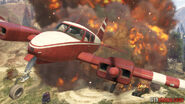 Trevor Philips flying a Cuban 800 away from an explosion.