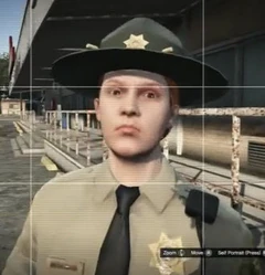 A female sheriff deputy with hat.