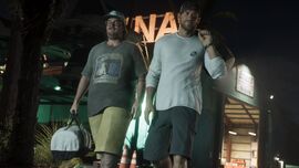 Jason and Cal passing by the marina in an official screenshot.