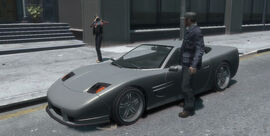 The coquette parked in front of the church.