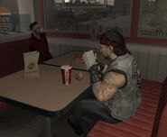 A Skinhead eating at Burger Shot with an Angels of Death biker.