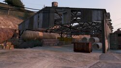 One of the warehouses in the scrapyard.