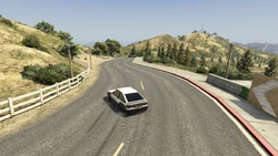 The racers proceed downhill