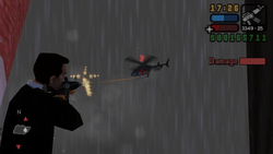 Toni shoots at Massimo's helicopter.