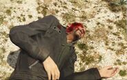 Johnny lying dead after Trevor's attack.