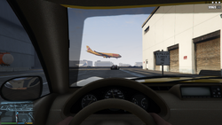 Entering the airport. Busy air-traffic is seen in the background.