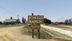 A sign pointing towards the ranch