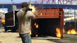 A shipping container opened by the explosion from an 