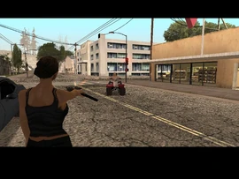 Catalina shooting one of the escaping robbers.