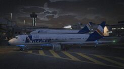 Air Herler planes in Los Santos International Airport at night.