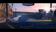 ...landing on the hood of a car beneath.