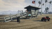 A Blazer Lifeguard parked next to a lifeguard stand.