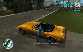 Tommy getting into the Stinger parked near the mansion.