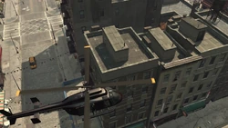 He is forced to find an escape through the rooftops. A helicopter arrives to attack him.