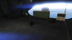 AssaultonATT16-GTAOe-DefenderLoadoutCrates4.png (2.25 MB) Defender loadout crates inside the main hangar, close to the Raiju.