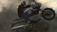 An NRG 900 in a pre-release GTA IV trailer, depicting an NRG 900F with an NRG 900RR badge, a different stripe on the body, and a later omitted "Shitzu" text on the underside.