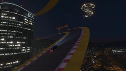 Continuing on a banked track around the 