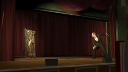 Helplessly watching the knives being thrown at her.