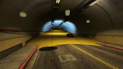 A yellow platform starts in the tunnel