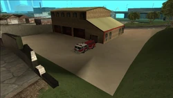 SanFierroFireStation-GTASA-FireTruck1.jpg (133 KB) A Fire Truck parked at the rear of the station.