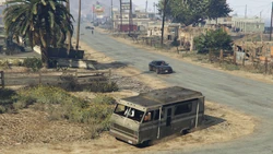 Escaping Ace Liquor, with additional enemies chasing on foot.