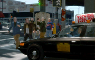 A beta Taxi in GTA IV, showing its former black color. Notice it spawns with both accessories on the roof.