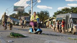 A woman riding the mobility scooter in an official screenshot of Grand Theft Auto VI.