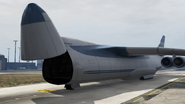 A Cargo Plane with the nose door opened.