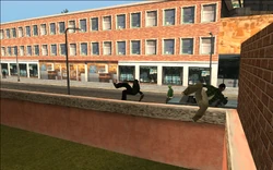 Sweet and the two Grove Street homeboys CJ recruited jump over the wall.