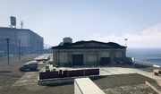 ElysianIsland-GTAO-VehicleWarehouseExterior.png
