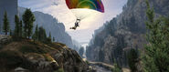 Skydiving over the wilderness. The parachutes are now changed.