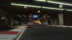 A ramp at the end of the straight leads the racers through one of the opening on 