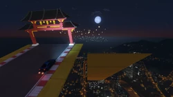 The racers use the track to jump onto a sloped yellow platform