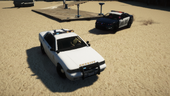 A Sheriff Cruiser joining an Interceptor during a pursuit at Del Perro Beach.