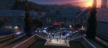 A party at the Richman Mansion with several new vehicles.