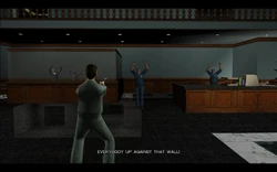 Phil yells at everyone to get up against the wall.