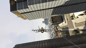 A  performing a knife through two buildings.