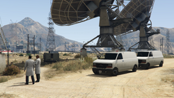 The scientists spawning at the station in the enhanced version of GTA V, with one or two Burritoes or Washingtons parked up.