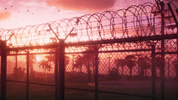 Close-up of the fence and parking lot.