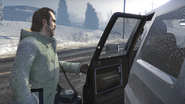 Trevor arrives at the getaway car.