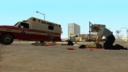 Las Venturas Paramedics (in blue uniforms) reviving two pedestrians in GTA San Andreas.