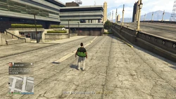 Text: Stash the weapons and get out of there before they see you on the cameras!