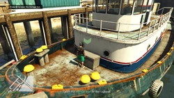 Open the storage box on the tugboat