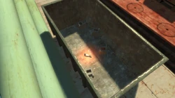 The flying rat inside the skip.